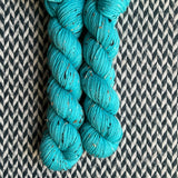 HIGHLIGHTER BLUE -- Half-Skein -- Alphabet City tweed sock yarn (black/grey nep) -- ready to ship