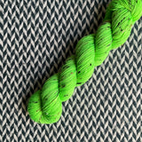 HIGHLIGHTER GREEN -- Half-Skein -- Alphabet City tweed sock yarn (black/grey nep) -- ready to ship