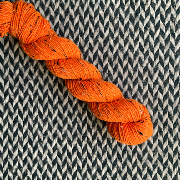 HIGHLIGHTER ORANGE -- Half-Skein -- Alphabet City tweed sock yarn (black/grey nep) -- ready to ship