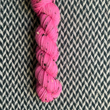 HIGHLIGHTER PINK -- Half-Skein -- Alphabet City tweed sock yarn (black/grey nep) -- ready to ship